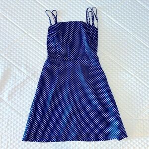 Navy/white polka dot mini dress,  criss cross lacing and ties in back